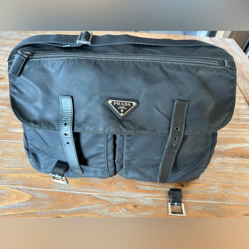 Prada crossbody bag(very worn out)one buckle fell off,nothing else wrong with it